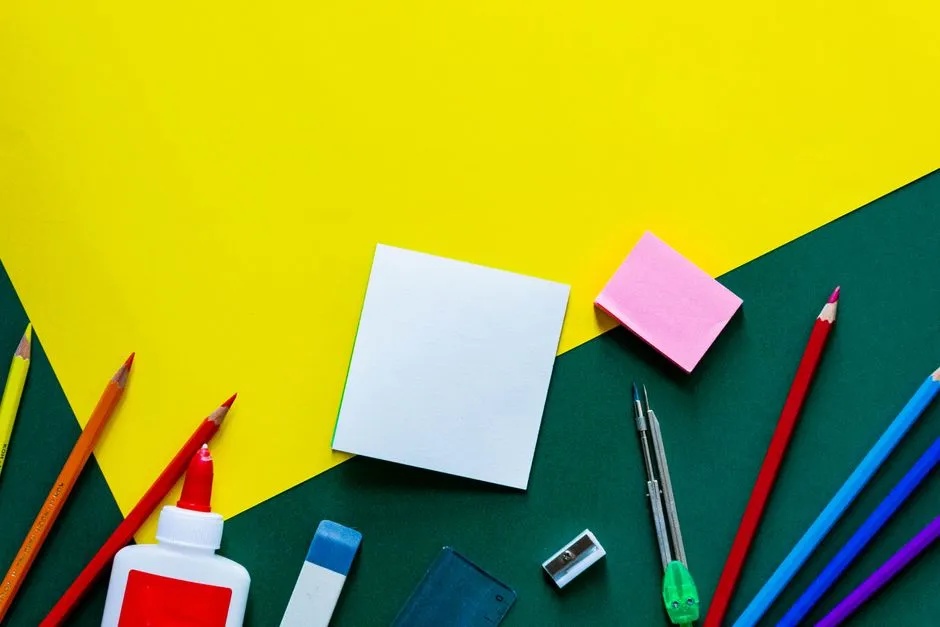 School supplies including notebooks and stationery laid out on a table